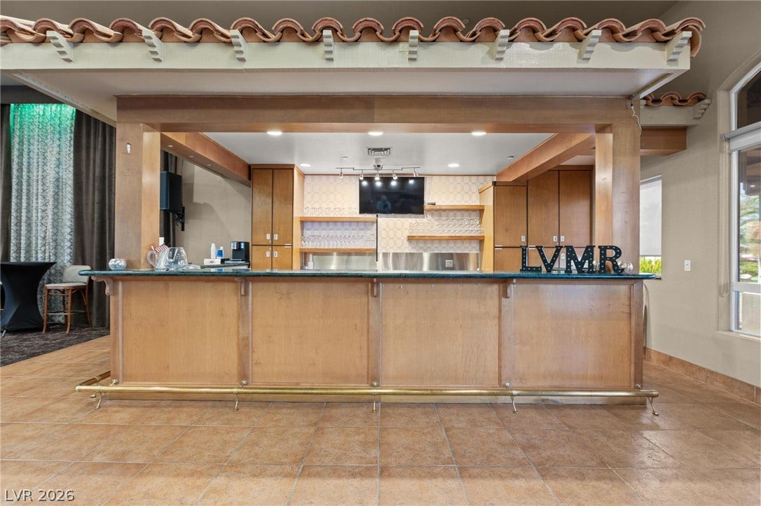 8175 Arville Street, #33, Las Vegas, NV 89139 An expansive built-in wet bar stands ready for entertaining on durable tile flooring.
