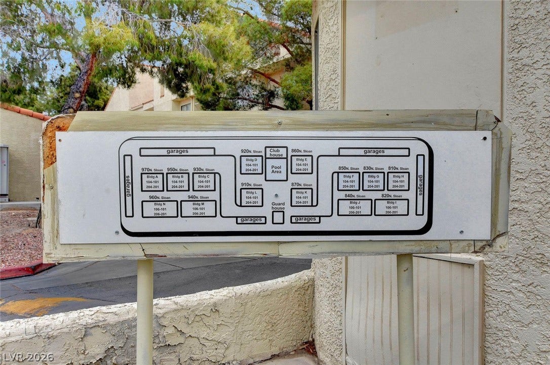 830 N Sloan Lane, #202, Las Vegas, NV 89110 A detailed site map near the stucco walls displays the community layout and building locations.