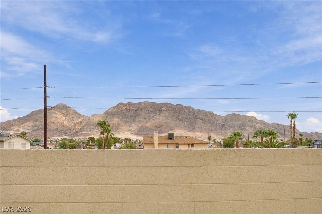 830 N Sloan Lane, #202, Las Vegas, NV 89110 Dramatic mountain vistas rise above the backyard privacy wall.