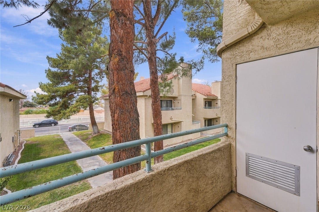 830 N Sloan Lane, #202, Las Vegas, NV 89110 Mature trees frame the neighborhood views from this private outdoor space.
