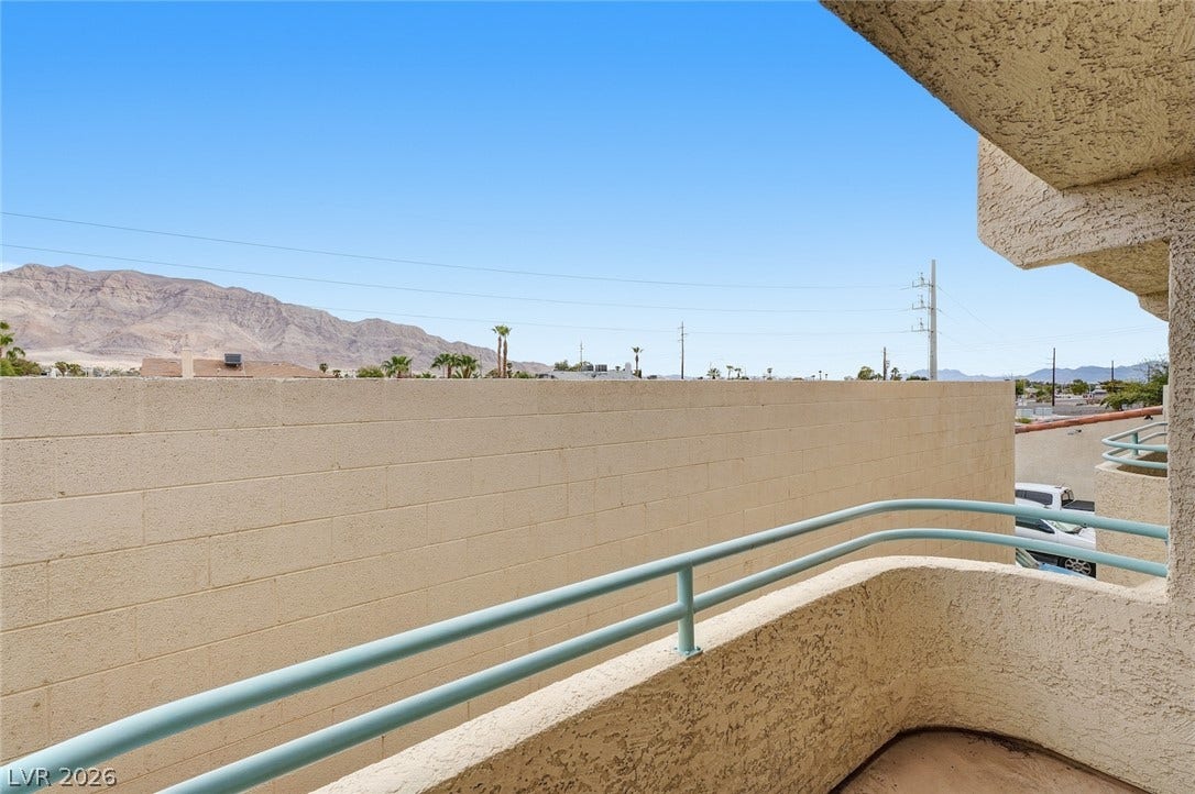 830 N Sloan Lane, #202, Las Vegas, NV 89110 Distant mountain views can be enjoyed from this elevated balcony.