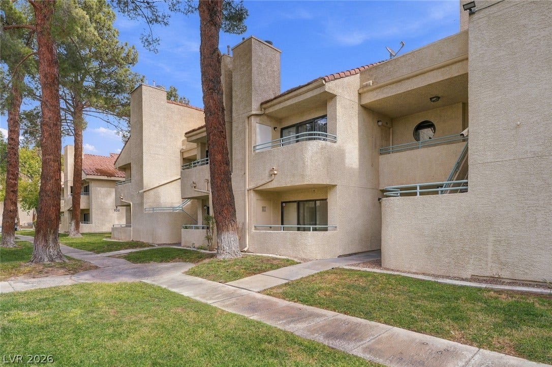 830 N Sloan Lane, #202, Las Vegas, NV 89110 Mature trees shade the concrete pathways leading to these classic multi-level stucco residences.