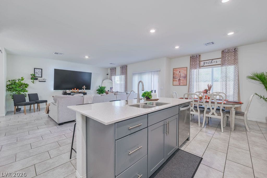 6135 Larimar Gold Street, North Las Vegas, NV 89115 An open floorplan seamlessly connects the kitchen island to the living and dining areas.