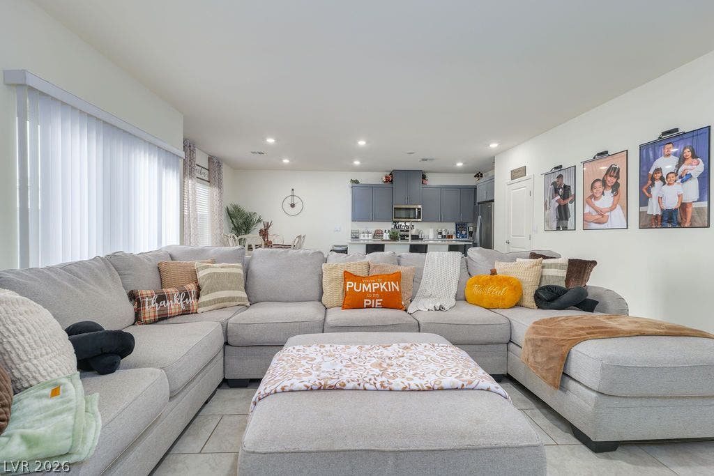 6135 Larimar Gold Street, North Las Vegas, NV 89115 An open layout connects the tiled living space directly to the kitchen area.