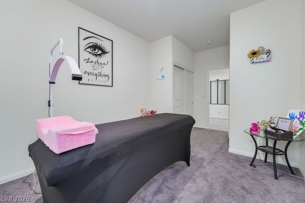 6135 Larimar Gold Street, North Las Vegas, NV 89115 Soft carpet underfoot and neutral walls anchor this versatile secondary bedroom space.