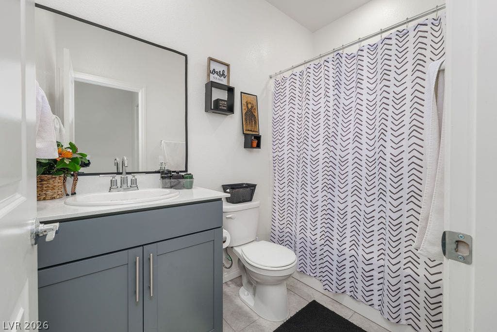 6135 Larimar Gold Street, North Las Vegas, NV 89115 A crisp white countertop pairs beautifully with modern shaker cabinetry and tile flooring.