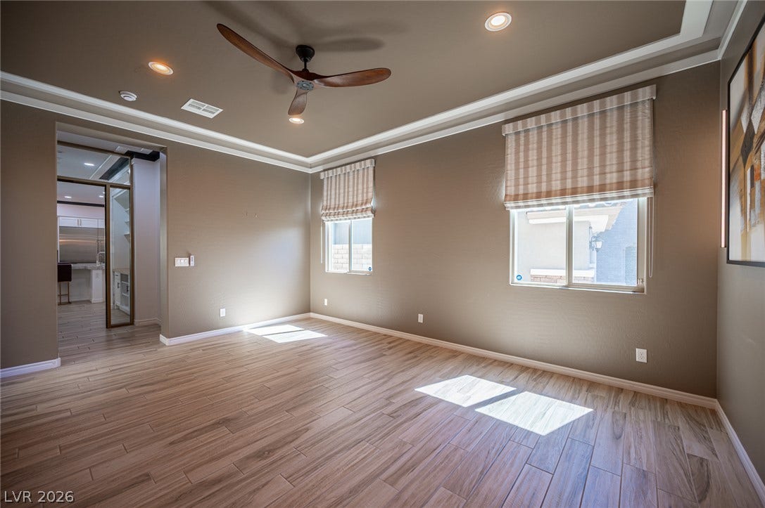 322 Elder View Drive, Las Vegas, NV 89138 Elegant wood-look tile flooring and crown molding highlight this versatile space.