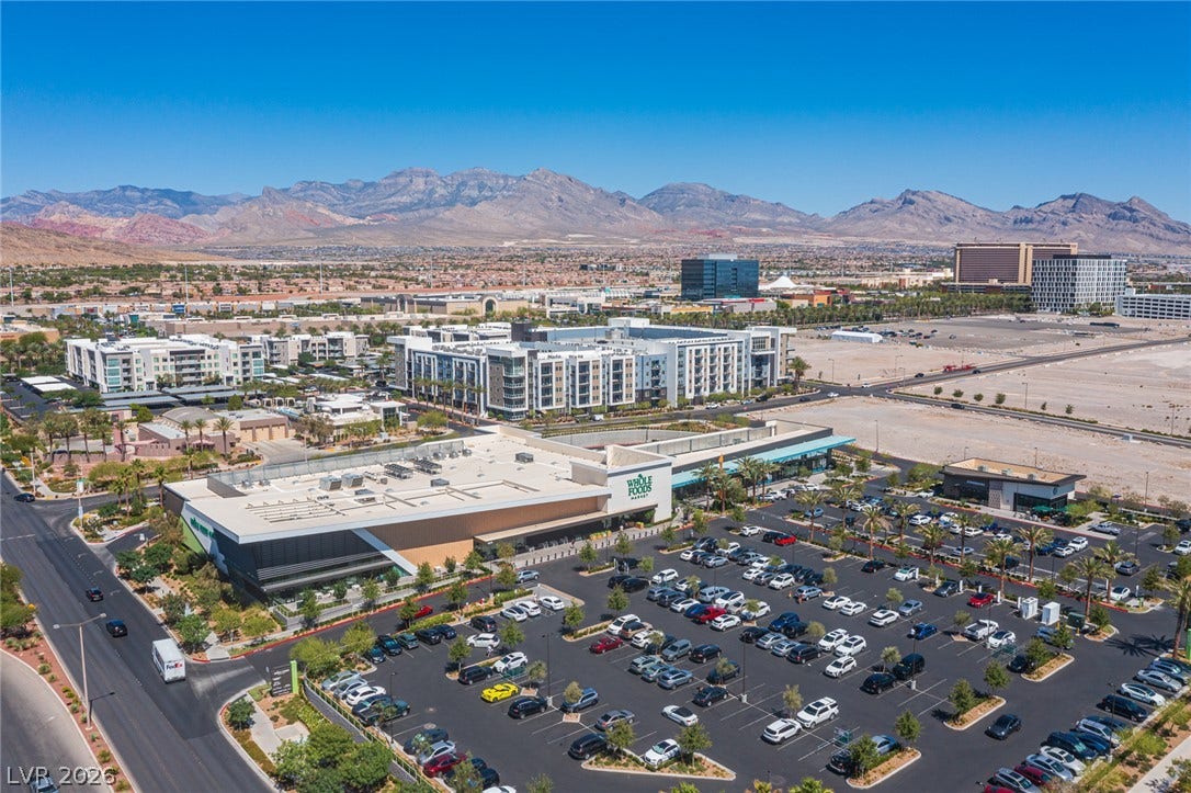 322 Elder View Drive, Las Vegas, NV 89138 A sweeping panorama captures the vibrant surrounding neighborhood framed by majestic mountain peaks.