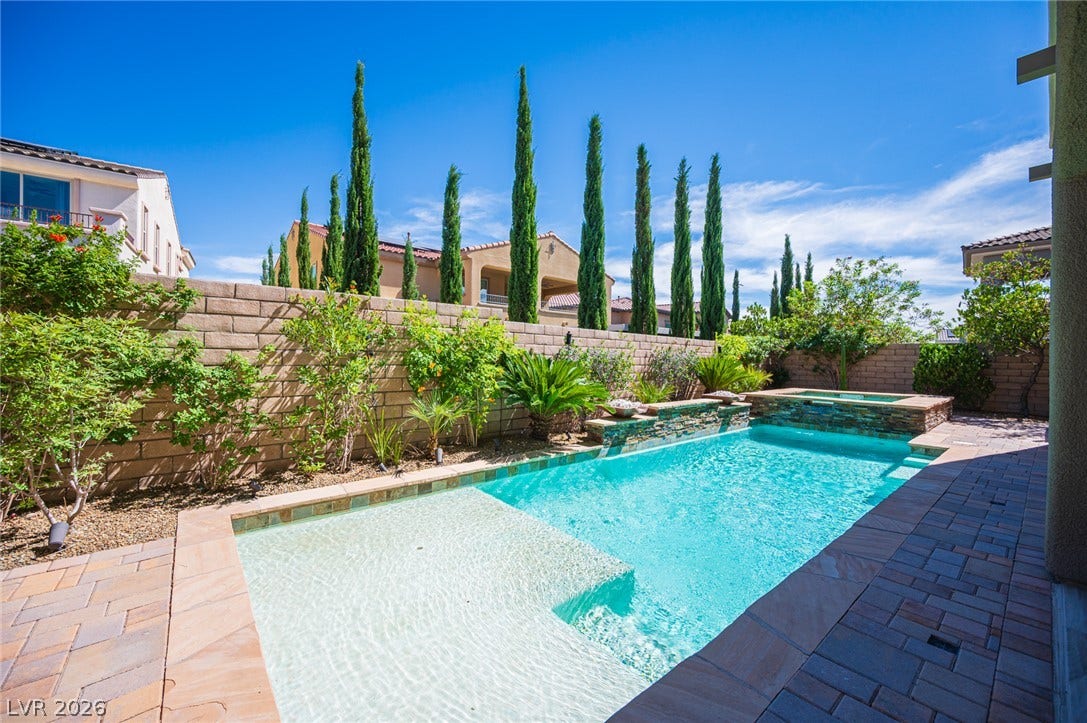 322 Elder View Drive, Las Vegas, NV 89138 Manicured cypress trees and a privacy block wall border this sparkling pool and spa.