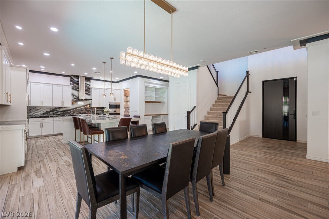 322 Elder View Drive, Las Vegas, NV 89138 An open floorplan seamlessly connects the dining area to the kitchen and staircase.