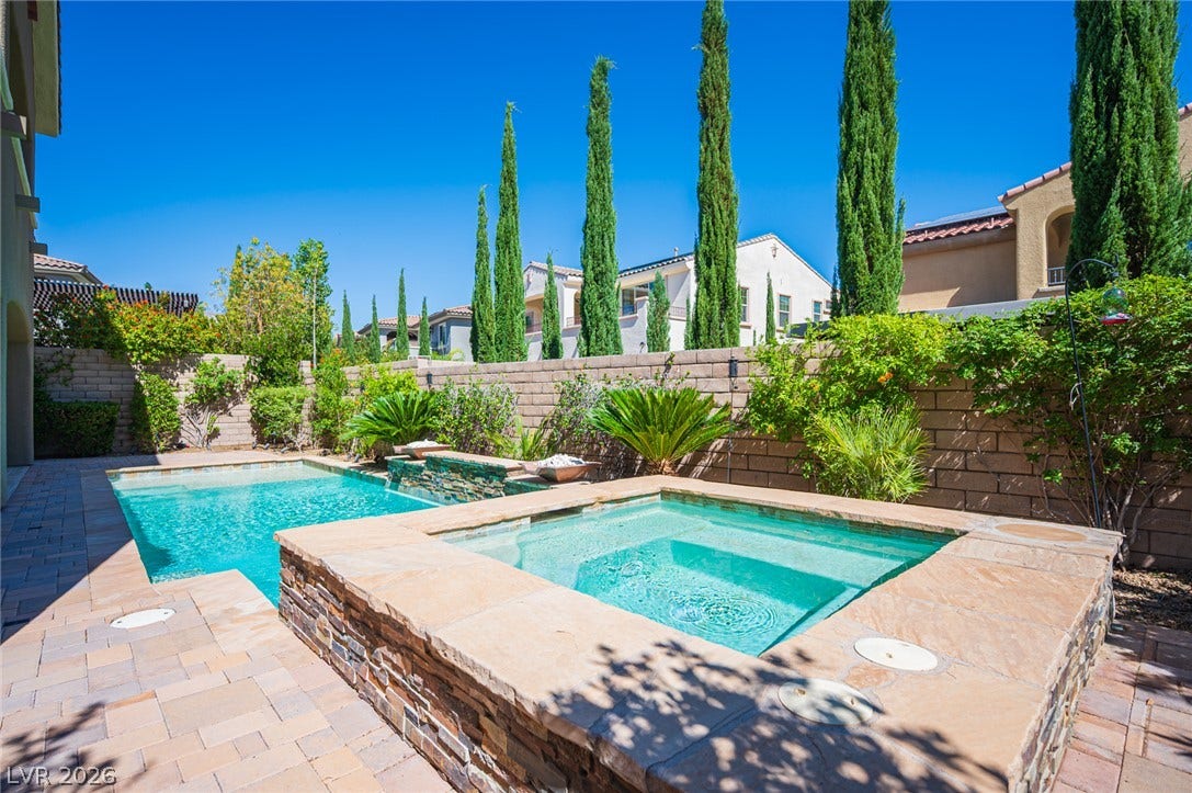 322 Elder View Drive, Las Vegas, NV 89138 A sparkling swimming pool and raised stone spa anchor this private, sun-drenched backyard oasis.