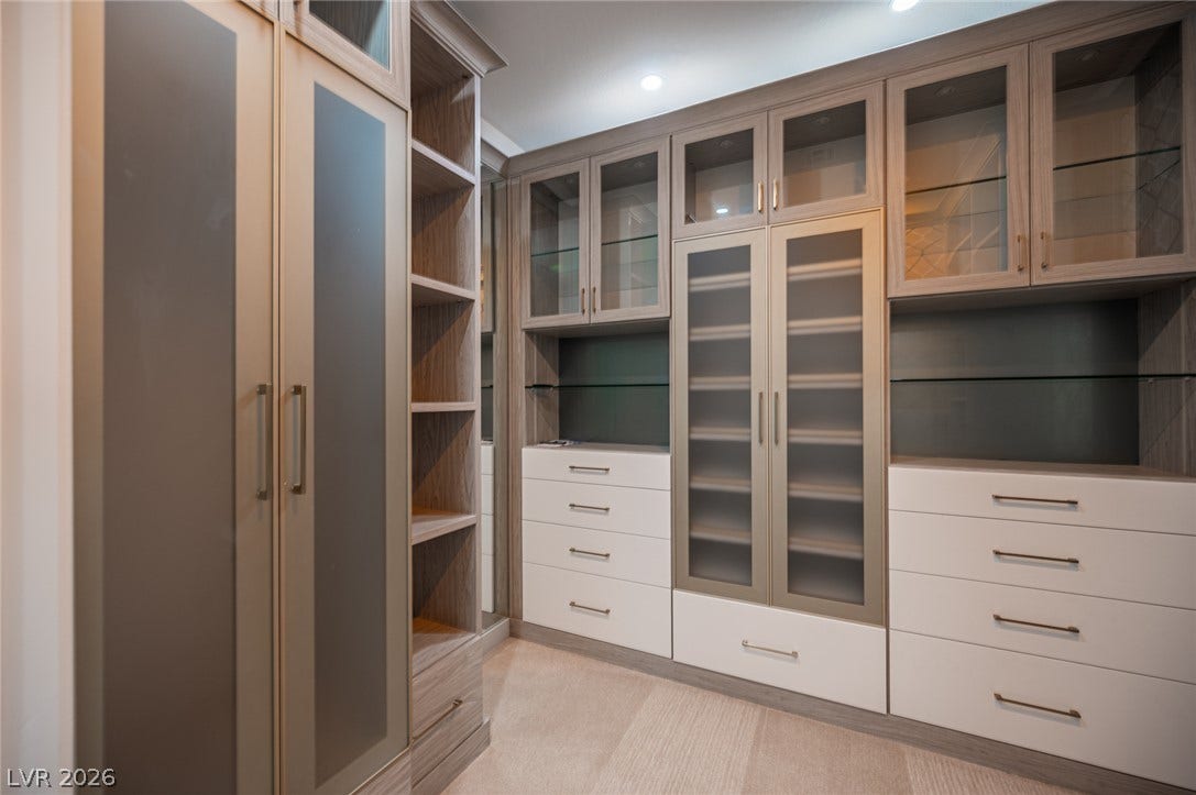 322 Elder View Drive, Las Vegas, NV 89138 Floor-to-ceiling custom cabinetry offers abundant integrated storage in this spacious walk-in closet.