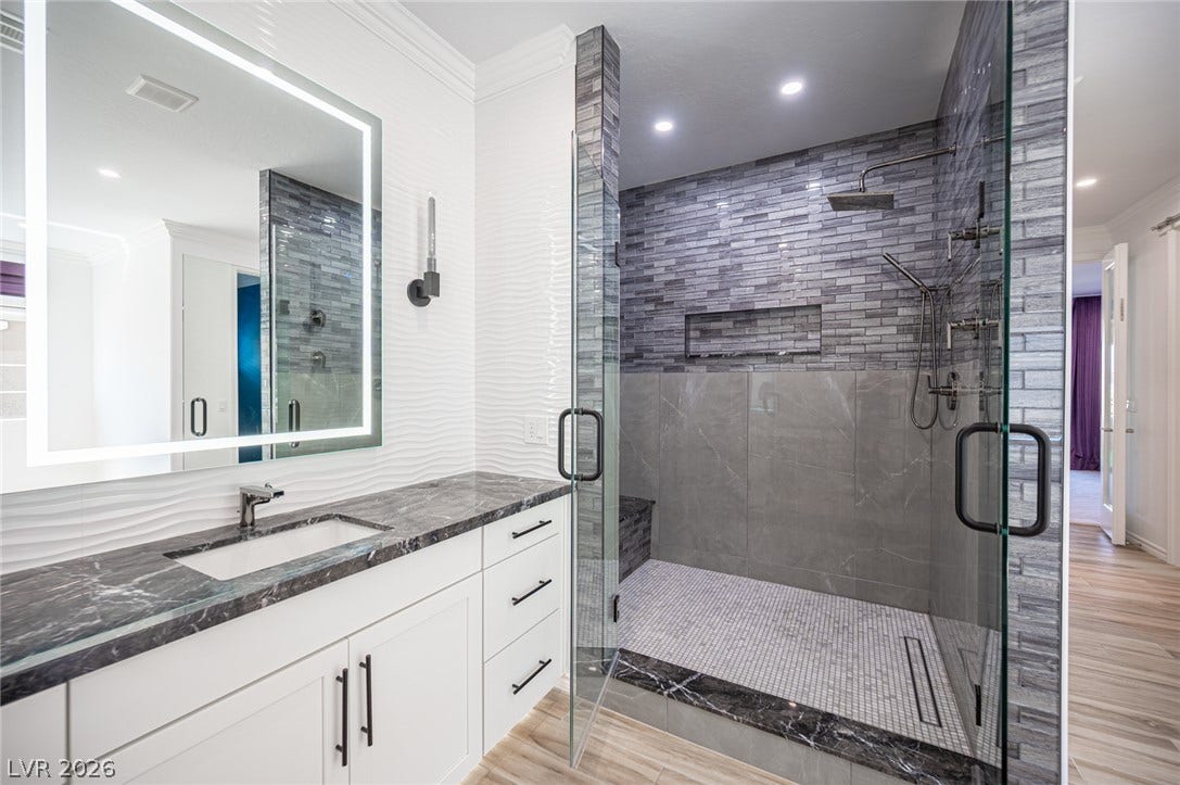 322 Elder View Drive, Las Vegas, NV 89138 An elegant bath features a massive walk-in tile shower and premium stone counters.