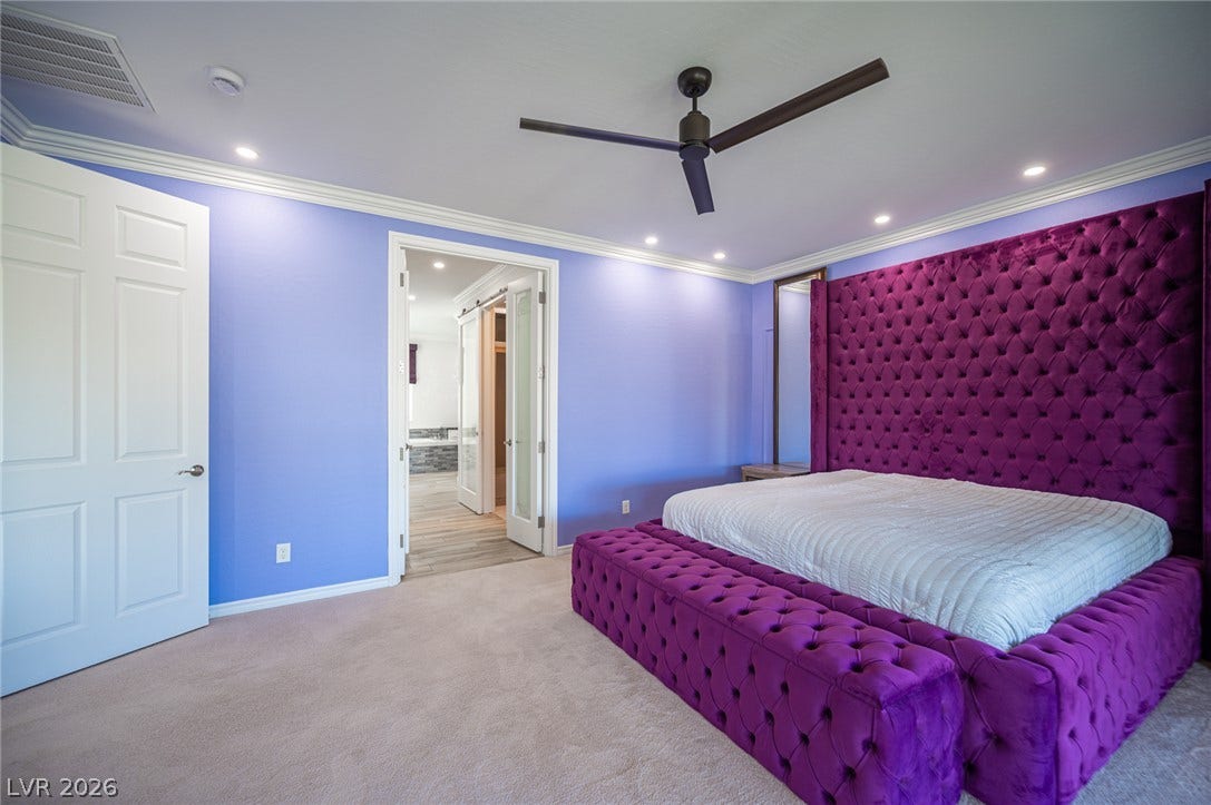 322 Elder View Drive, Las Vegas, NV 89138 Plush carpeted flooring and elegant crown molding define this spacious secondary suite.