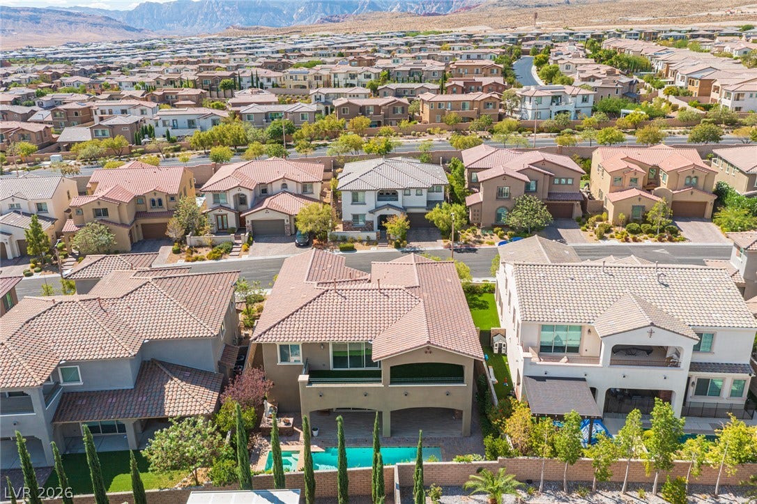 322 Elder View Drive, Las Vegas, NV 89138 An elevated perspective showcases the tiled rooftops and private backyard swimming pool in this peaceful neighborhood.