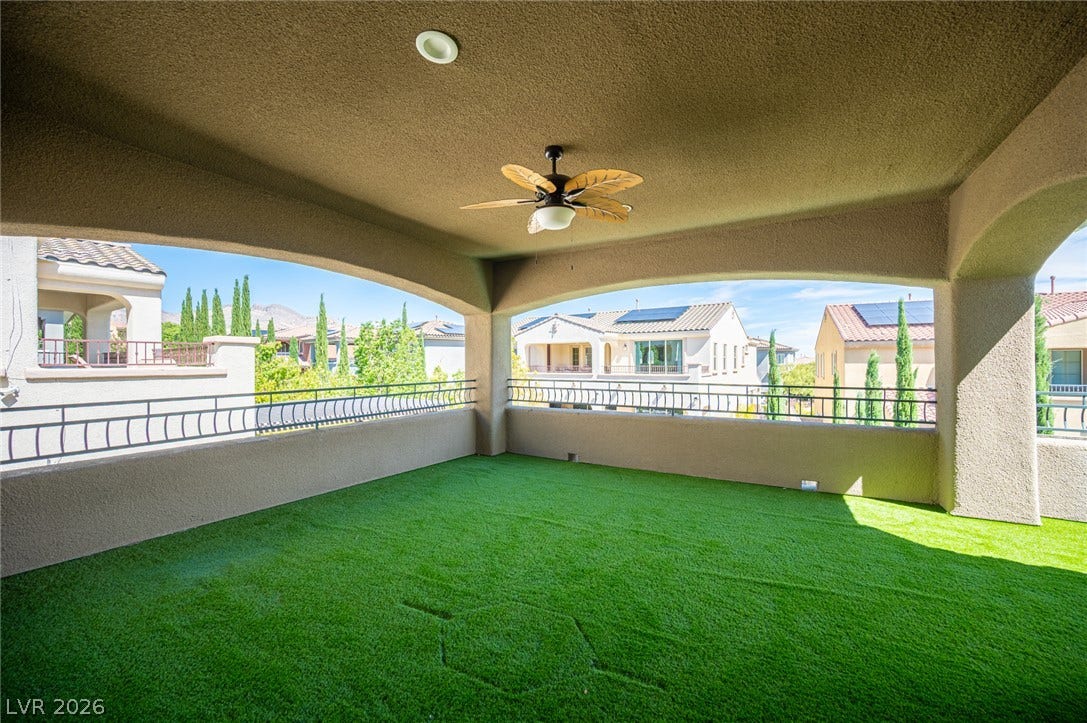322 Elder View Drive, Las Vegas, NV 89138 A spacious covered balcony provides sweeping neighborhood views through broad arched openings.
