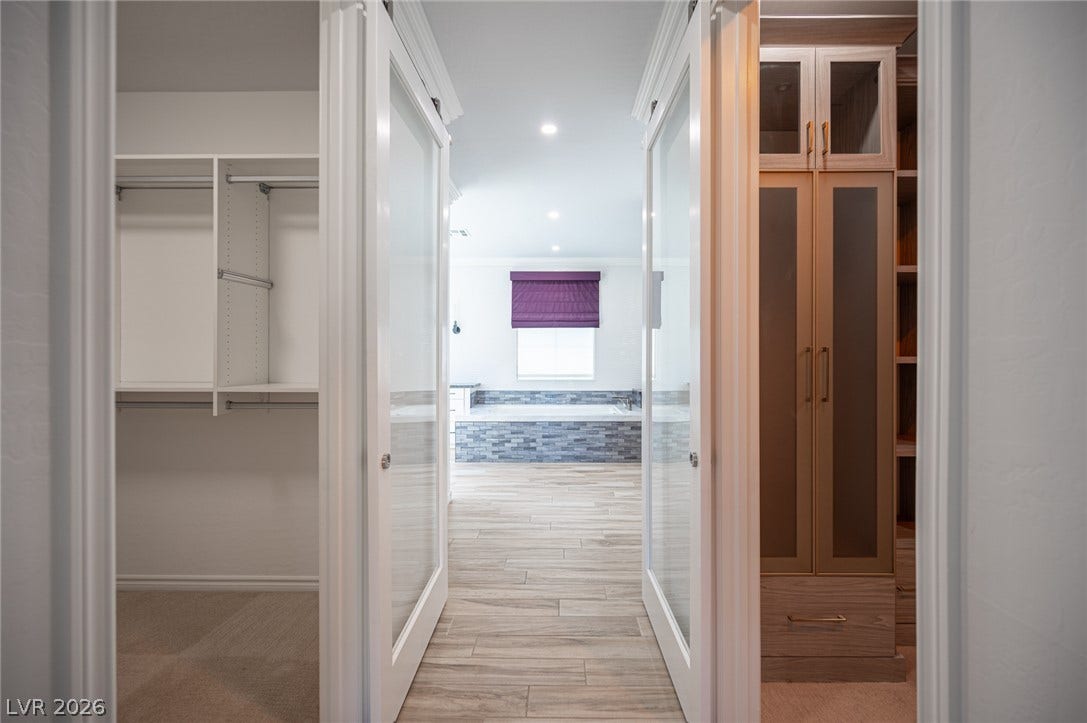 322 Elder View Drive, Las Vegas, NV 89138 Double doors open to a spacious walk-in closet featuring extensive built-in storage systems.