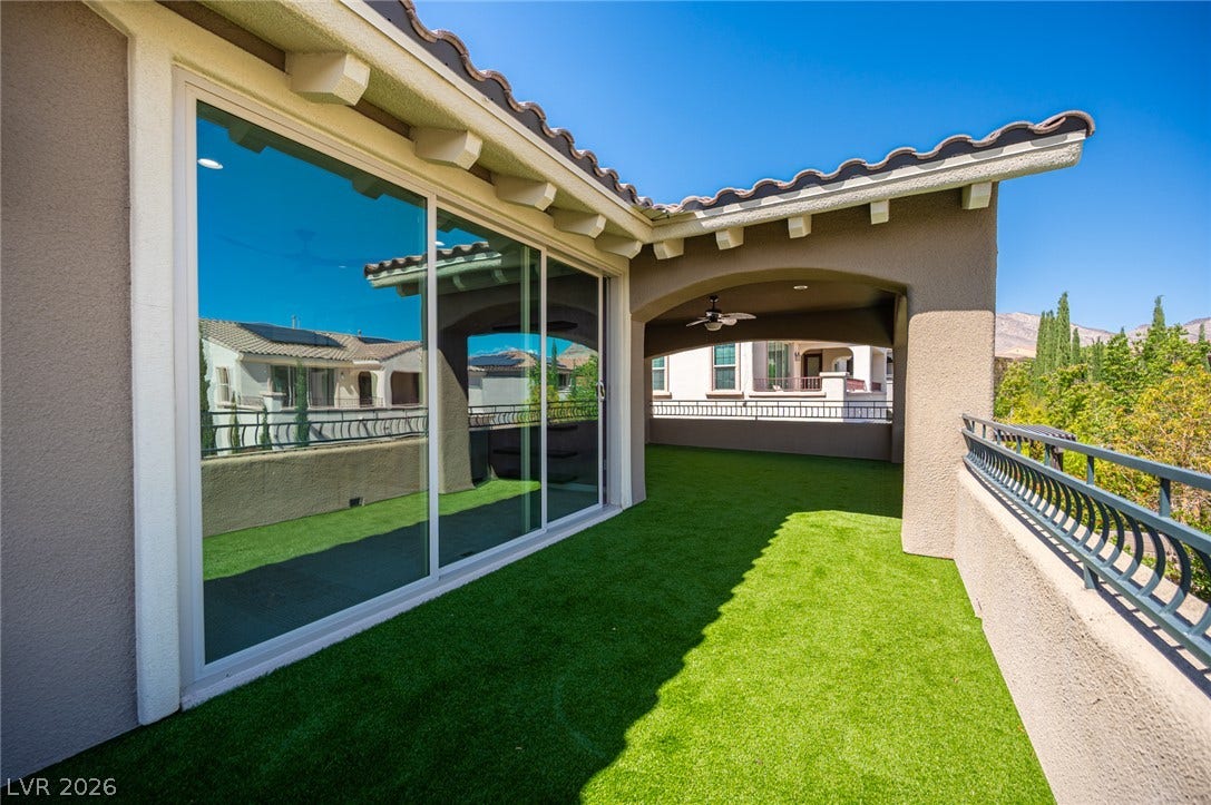 322 Elder View Drive, Las Vegas, NV 89138 An elevated terrace features synthetic turf and sweeping views of the surrounding neighborhood.
