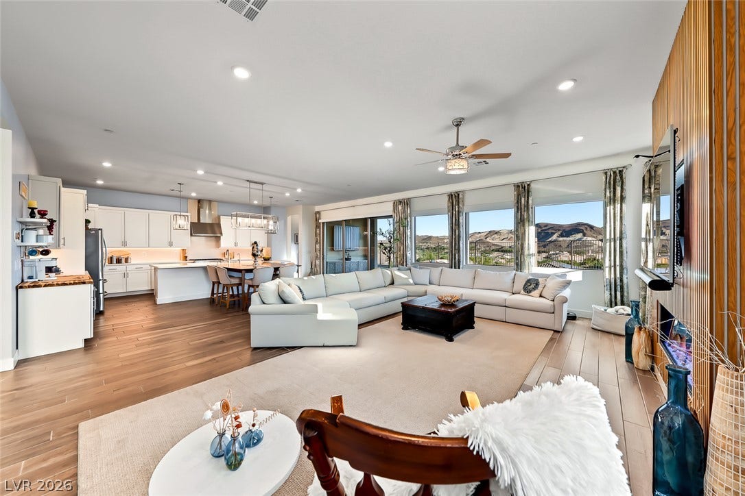 Hardwood floors and massive windows frame beautiful mountain vistas in this open concept layout.