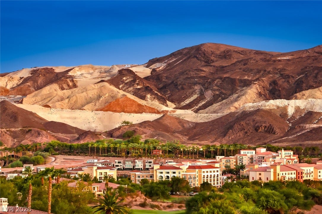 Dramatic mountain vistas rise above the peaceful community below.