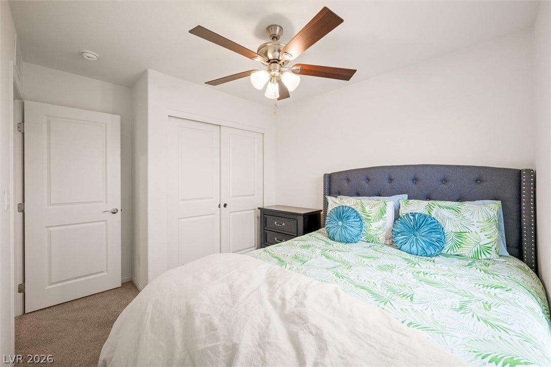 5651 Scarlet Rock Street, North Las Vegas, NV 89081 Plush carpeting underfoot sets a comfortable tone throughout this serene sleeping space.