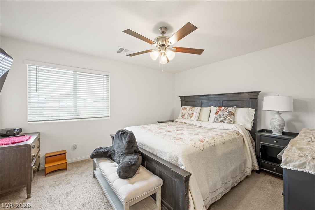 5651 Scarlet Rock Street, North Las Vegas, NV 89081 Plentiful natural light and soft carpeting define this inviting space.