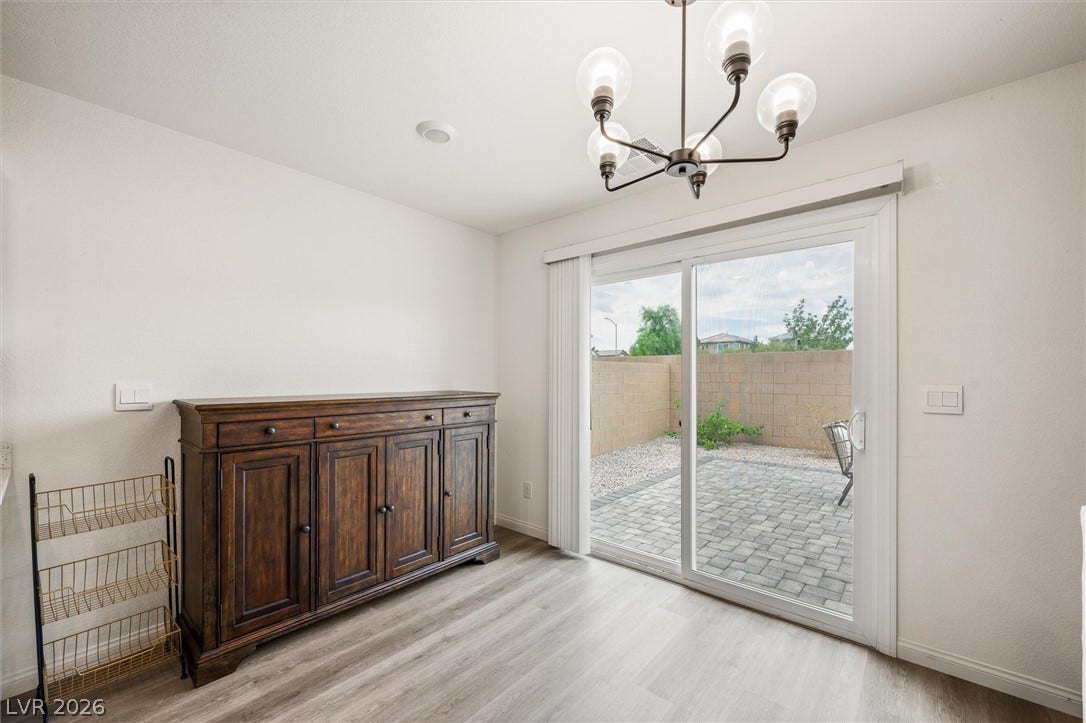 5651 Scarlet Rock Street, North Las Vegas, NV 89081 Sliding glass doors open directly to a private paved patio area.