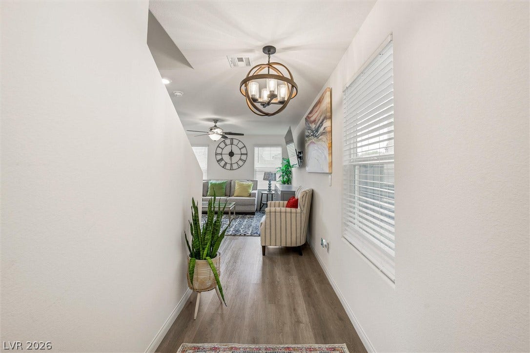 5651 Scarlet Rock Street, North Las Vegas, NV 89081 A welcoming entryway transitions smoothly into the open-concept living space beyond.