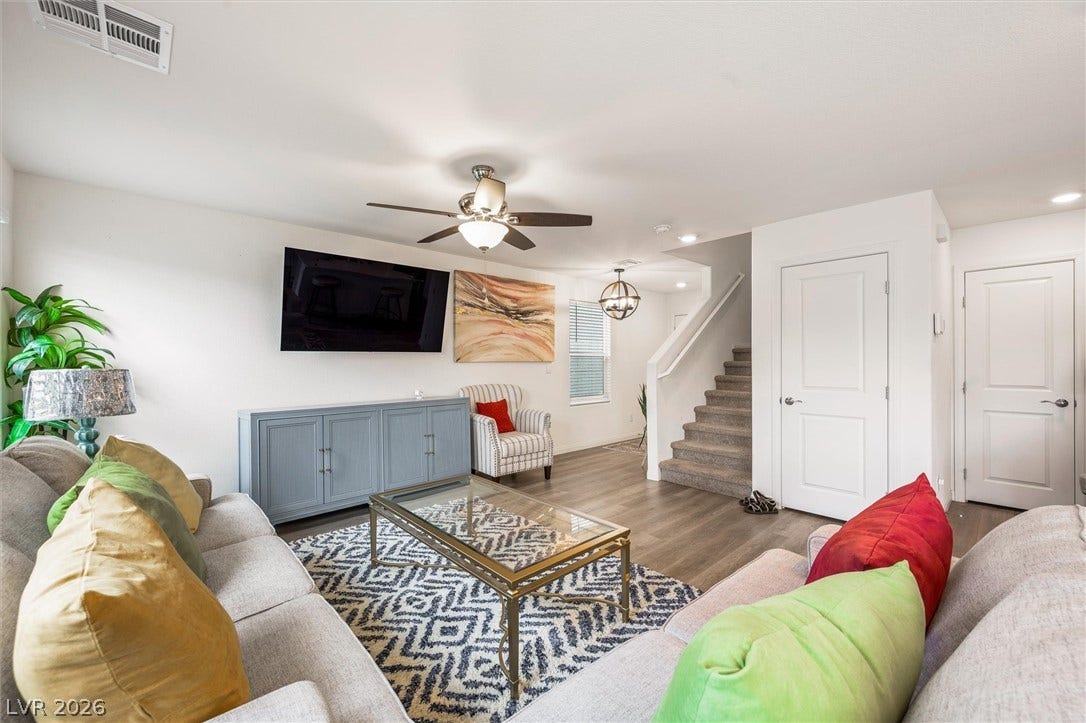 5651 Scarlet Rock Street, North Las Vegas, NV 89081 Gleaming hardwood floors and a modern open layout define this inviting living area.