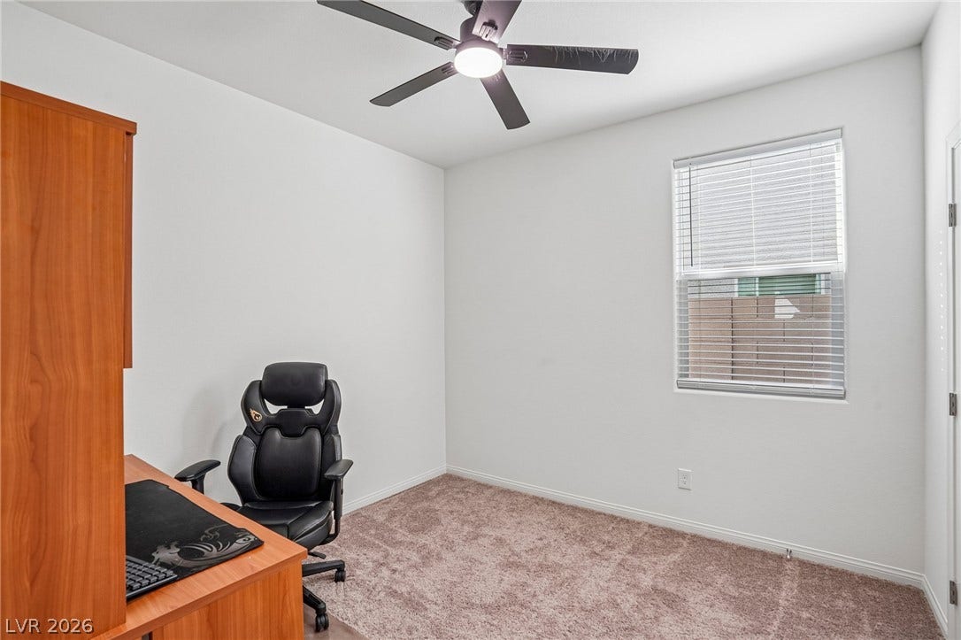 5937 Violet Crown Street, North Las Vegas, NV 89081 Plush carpeting and a classic window frame this versatile secondary space.