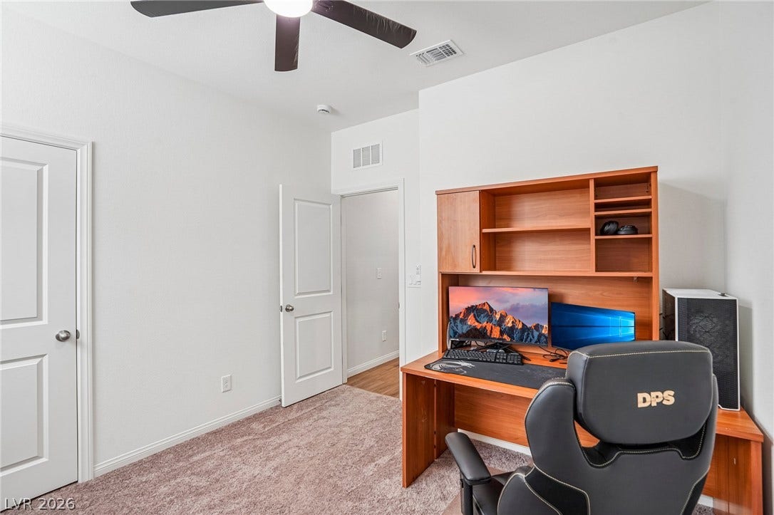 5937 Violet Crown Street, North Las Vegas, NV 89081 Smooth walls and soft carpeting define this quiet home office space.