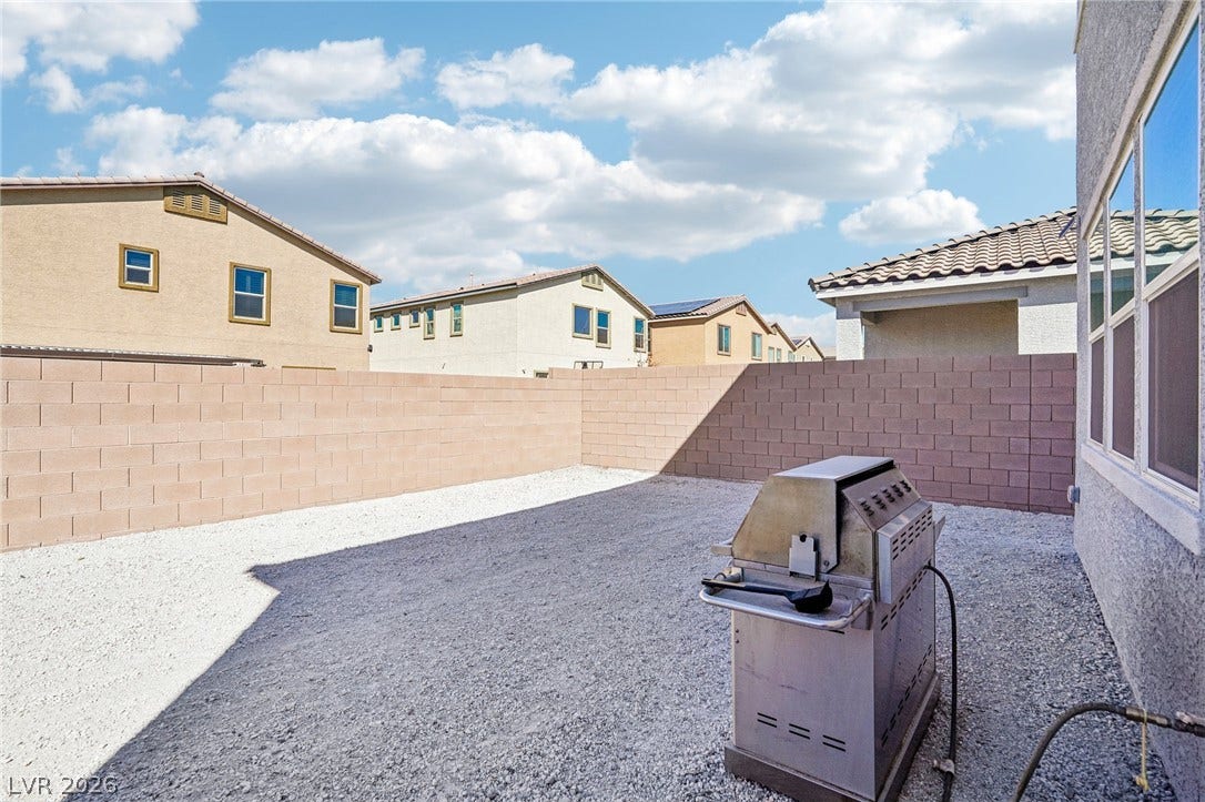 5937 Violet Crown Street, North Las Vegas, NV 89081 An enclosed backyard space features high block wall fencing for privacy.