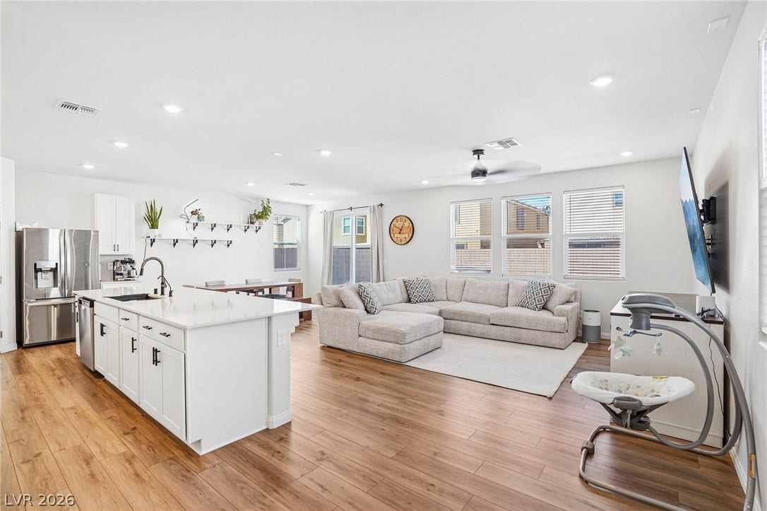 5937 Violet Crown Street, North Las Vegas, NV 89081 Gleaming hardwood floors and recessed lighting enhance the open layout of this modern main level.