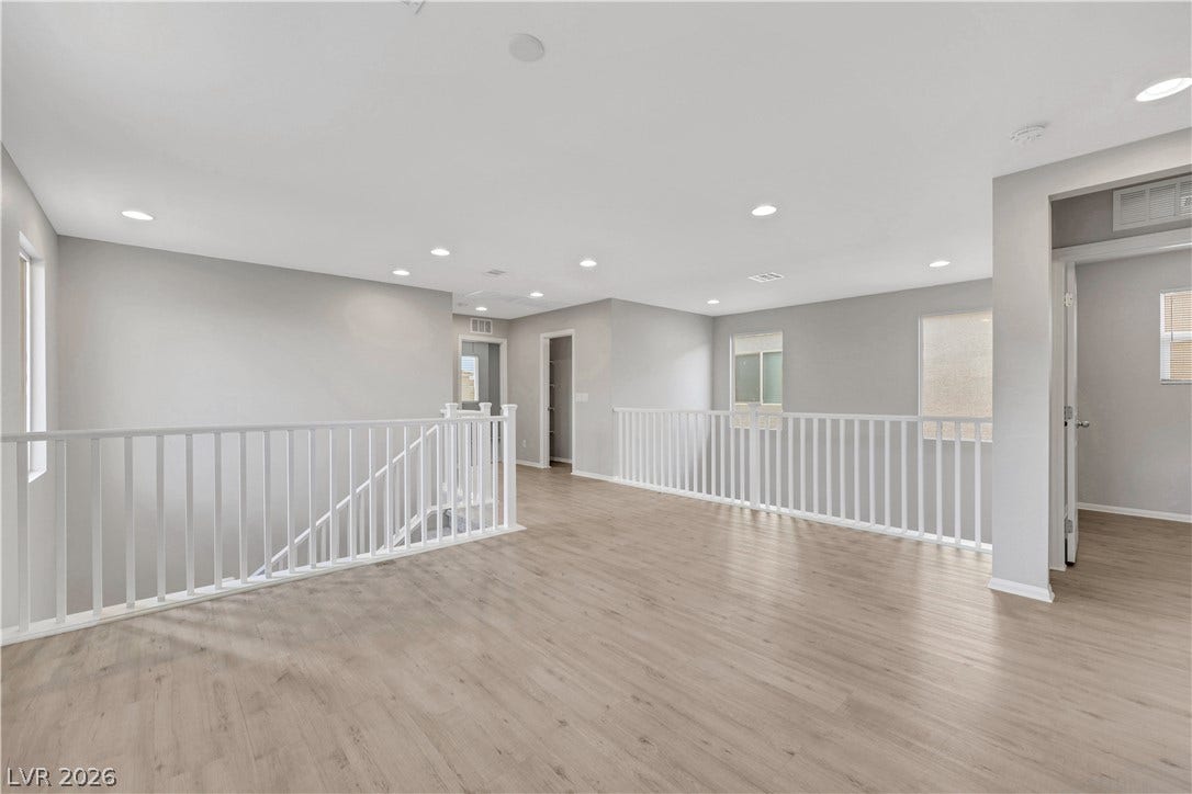 Upstairs Spacious Loft with natural lighting and smooth vinyl plank flooring.