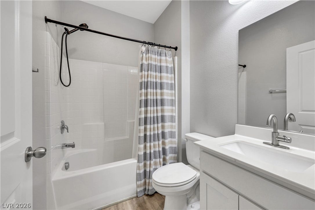 Full Bathroom Downstairs with classic tile finishes define this serene bathroom space.