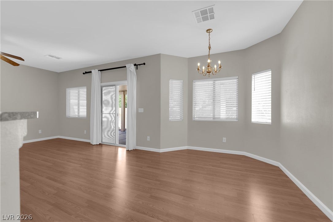 1158 Ekalaka Road, Henderson, NV 89052 Gleaming hardwood floors and tall windows define this open dining space.