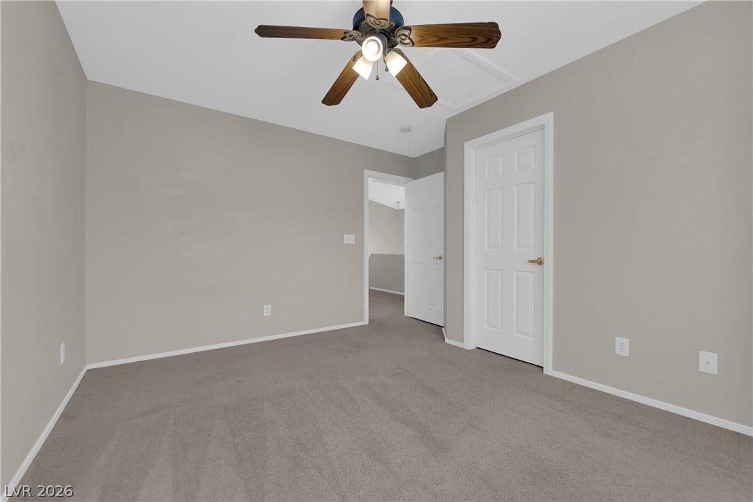 1158 Ekalaka Road, Henderson, NV 89052 Plush carpeting and crisp white trim enhance this versatile upstairs room.