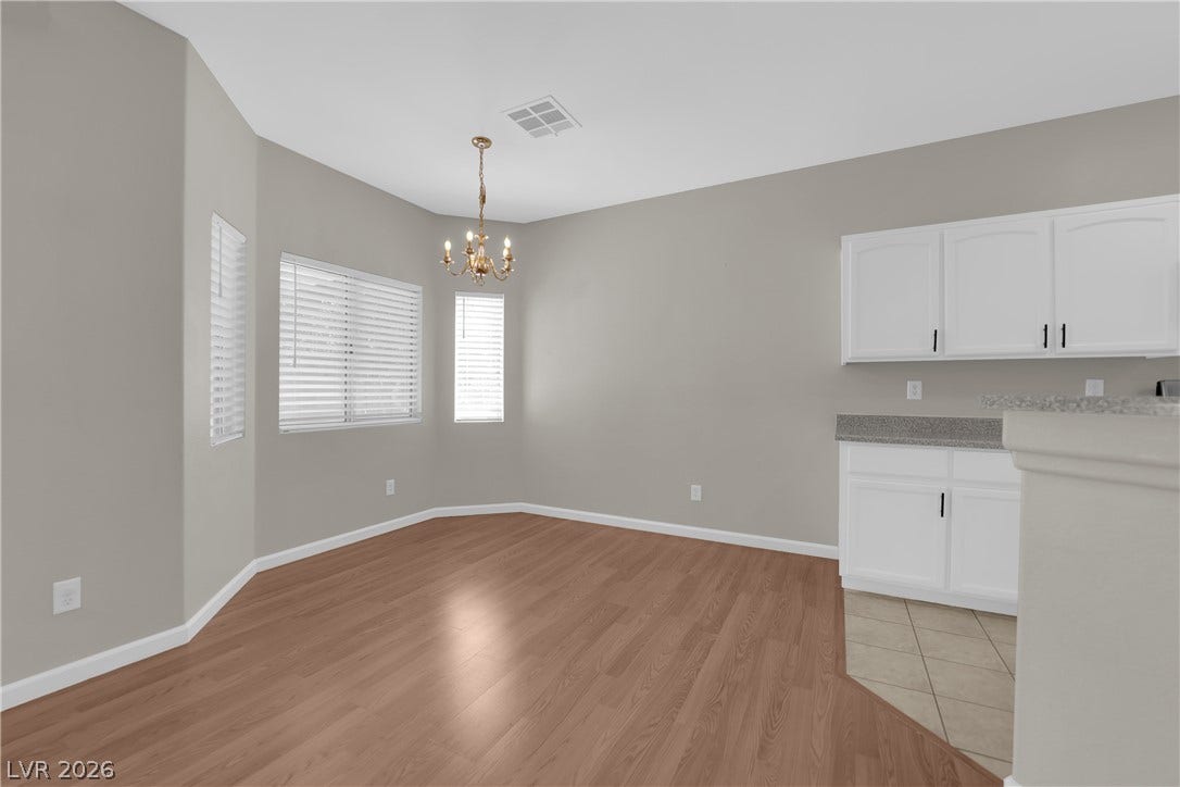 1158 Ekalaka Road, Henderson, NV 89052 An inviting dining space connects seamlessly with the kitchen area under high ceilings.