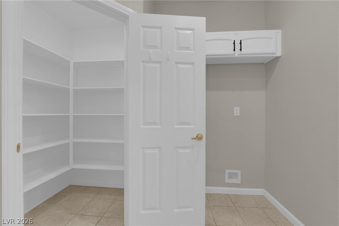 1158 Ekalaka Road, Henderson, NV 89052 Tiled flooring and built-in shelving maximize the utility of this organized storage space.