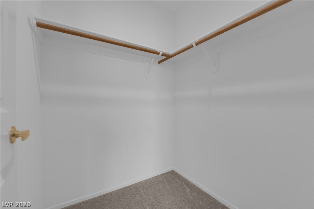 1158 Ekalaka Road, Henderson, NV 89052 Ample hanging rods and soft carpeting maximize storage efficiency in this closet space.