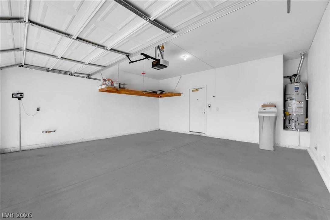1158 Ekalaka Road, Henderson, NV 89052 Smooth concrete flooring and built-in overhead shelving define this neat vehicle storage space.