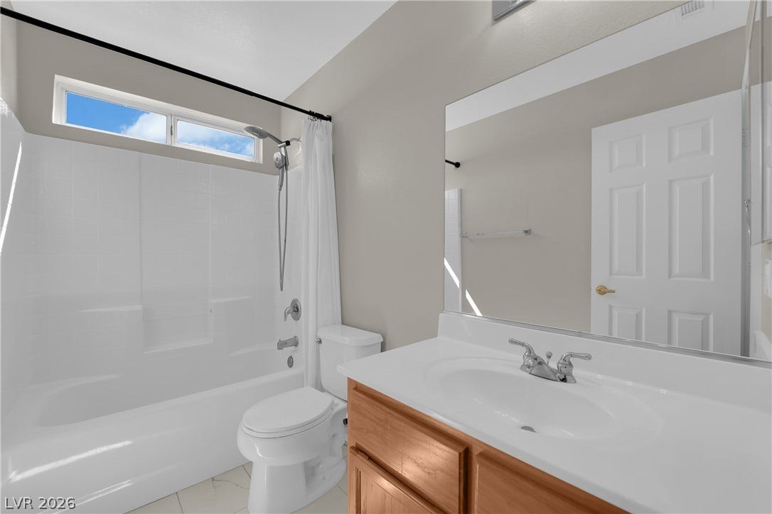 1158 Ekalaka Road, Henderson, NV 89052 A classic bathtub and single vanity setup defines this practical bathroom space.