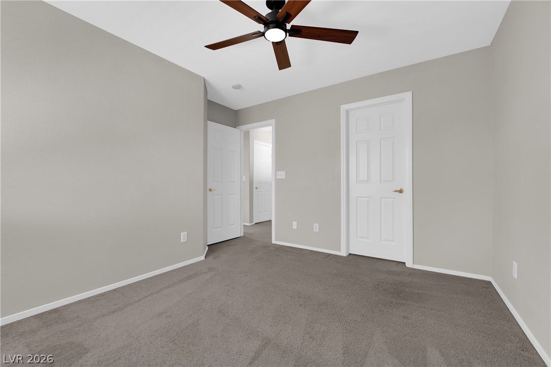 1158 Ekalaka Road, Henderson, NV 89052 Plush carpeting anchors this versatile room boasting clean plaster walls and classic white trim.