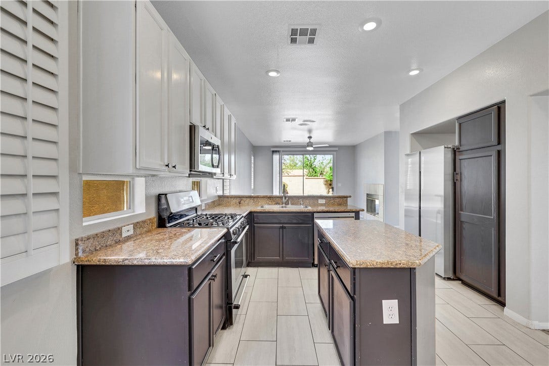 An open-concept layout connects this updated cooking space directly to the adjacent living areas.