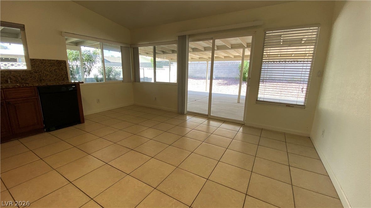 Las Vegas, NV 89119 Tiled flooring and sliding glass doors connect this casual dining area to the backyard.