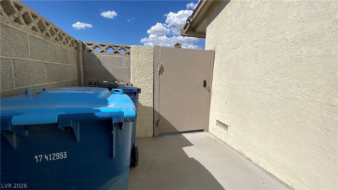 Las Vegas, NV 89119 Secure stucco and masonry walls enclose this practical side yard pathway.