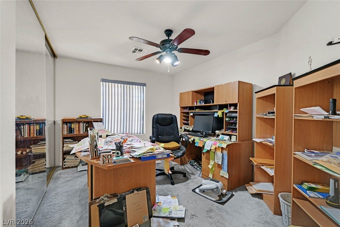 805 Stillwater Lane, Henderson, NV 89014 Mirrored closet doors and soft carpeting define this versatile home workspace.