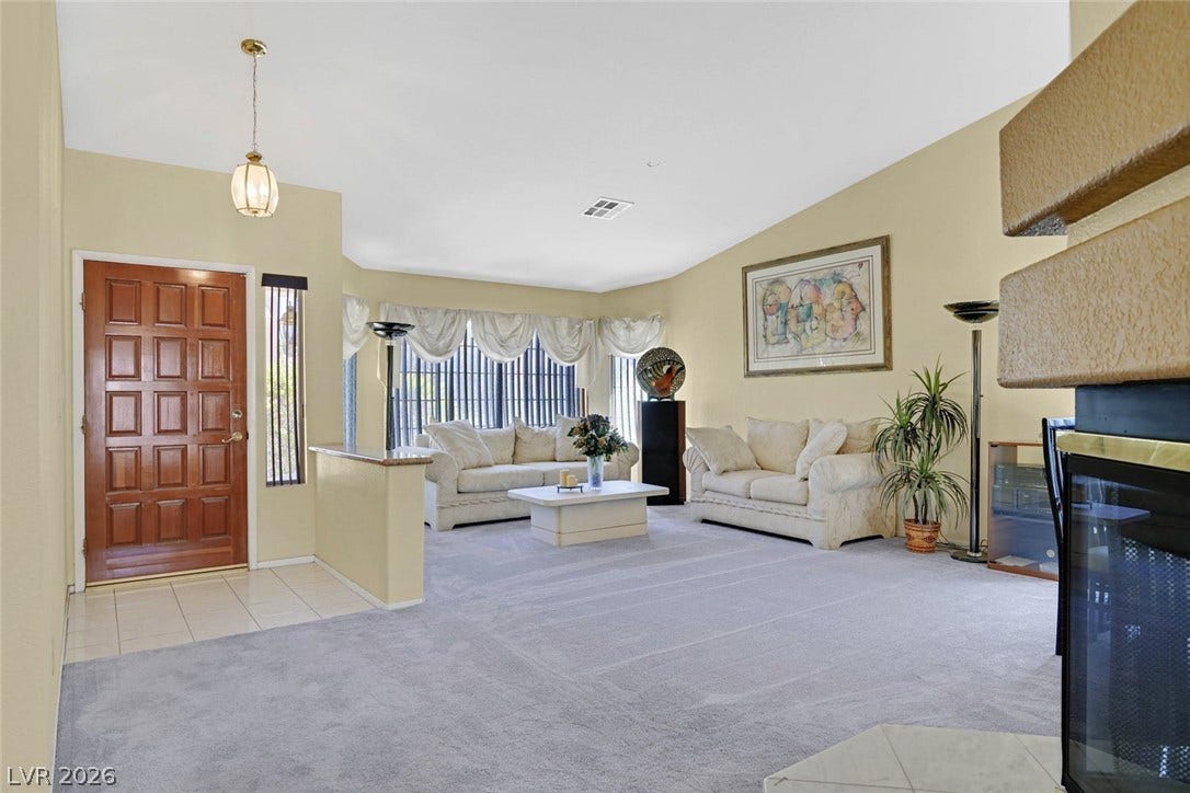 805 Stillwater Lane, Henderson, NV 89014 An inviting entrance foyer transitions seamlessly into a spacious living area featuring vaulted ceilings.