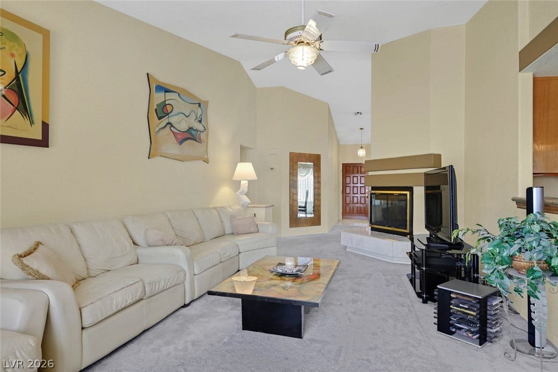 805 Stillwater Lane, Henderson, NV 89014 An inviting fireplace serves as the focal point in this spacious living room with vaulted ceilings.