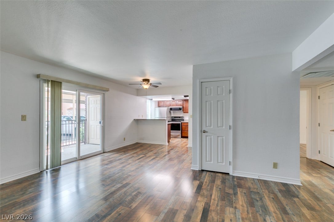5240 Indian River Drive, #273, Las Vegas, NV 89103 Gleaming wood-look floors anchor this airy living space opening directly to the kitchen area.